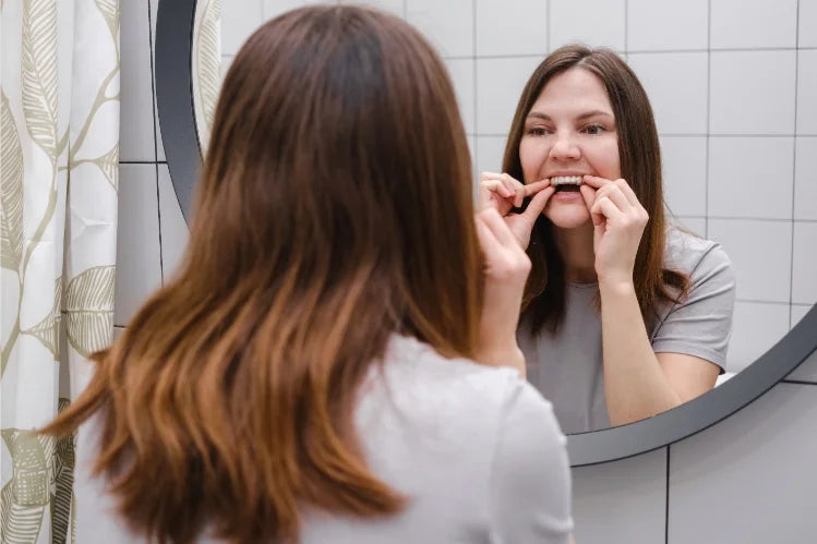 Woman putting on clear aligners